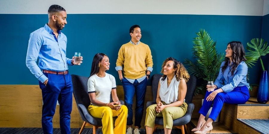 Employees gathering together at work