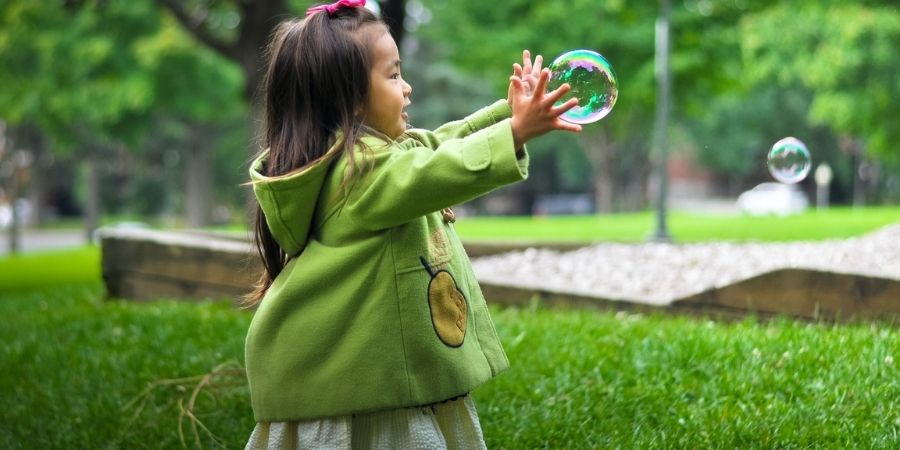 Child girl outside playing
